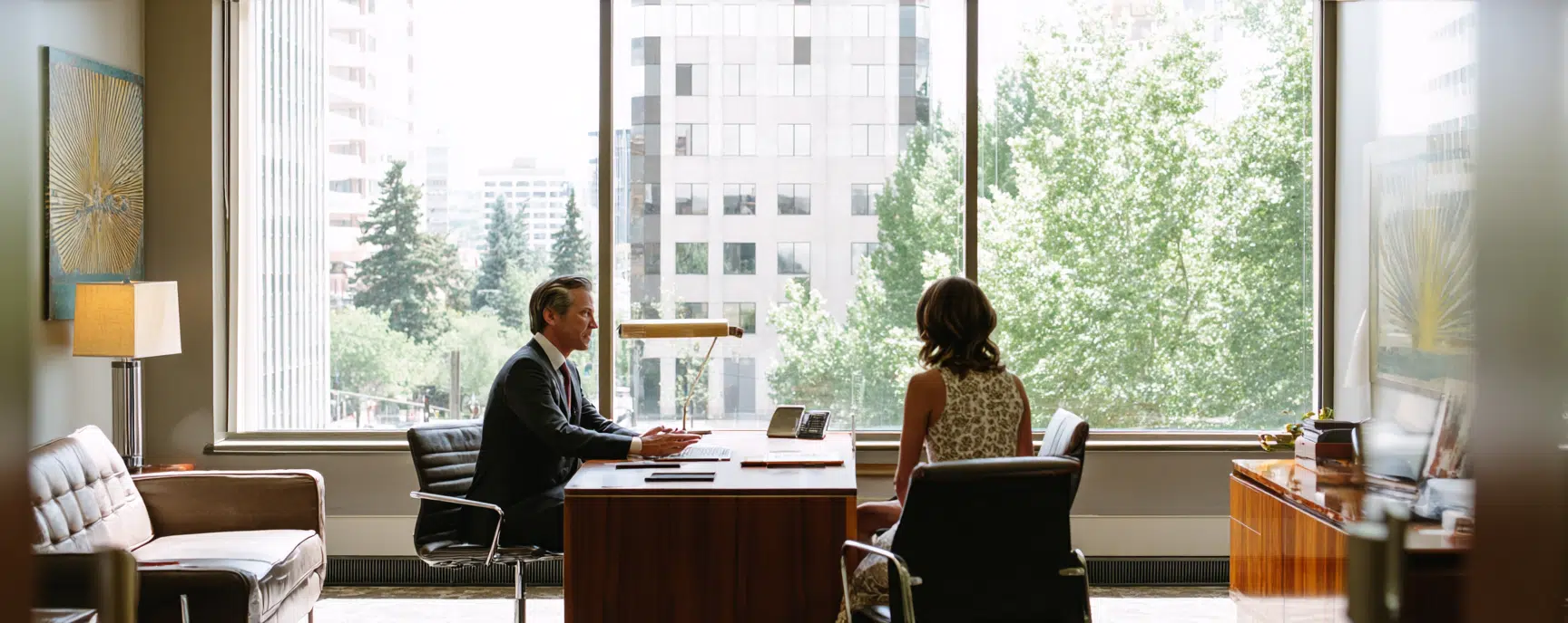 A Portland personal injury attorney explaining the settlement process to a client